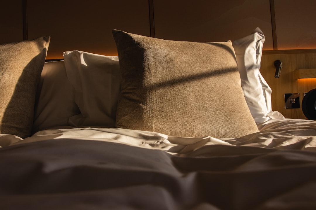 Pillow on a bed in a bright bedroom