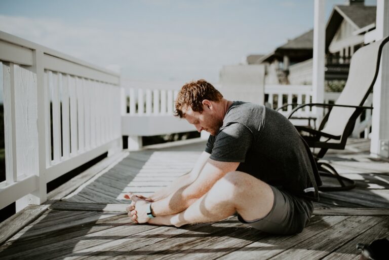 Man stretching his back outdoors in the morning