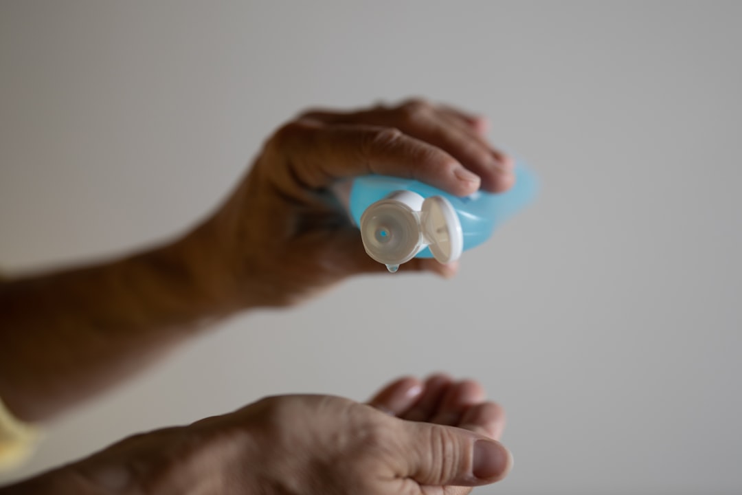 Topical pain relief gel bottle in hand