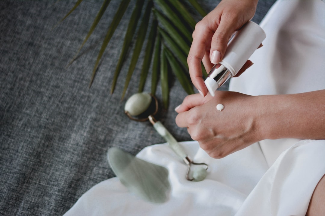 Topical cream being applied to skin