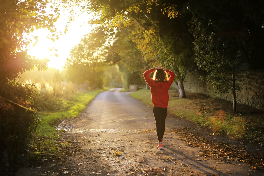 Person getting morning sunlight outdoors to help reset circadian rhythm