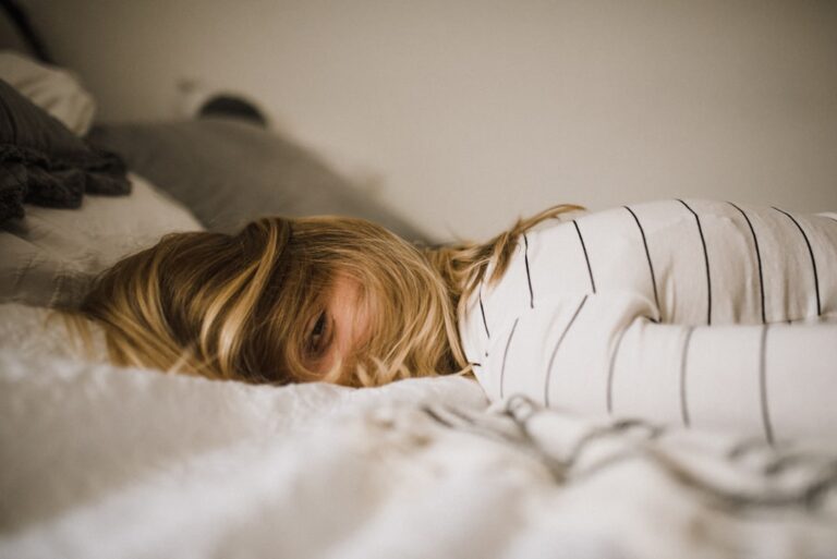 Person sleeping face down on their stomach