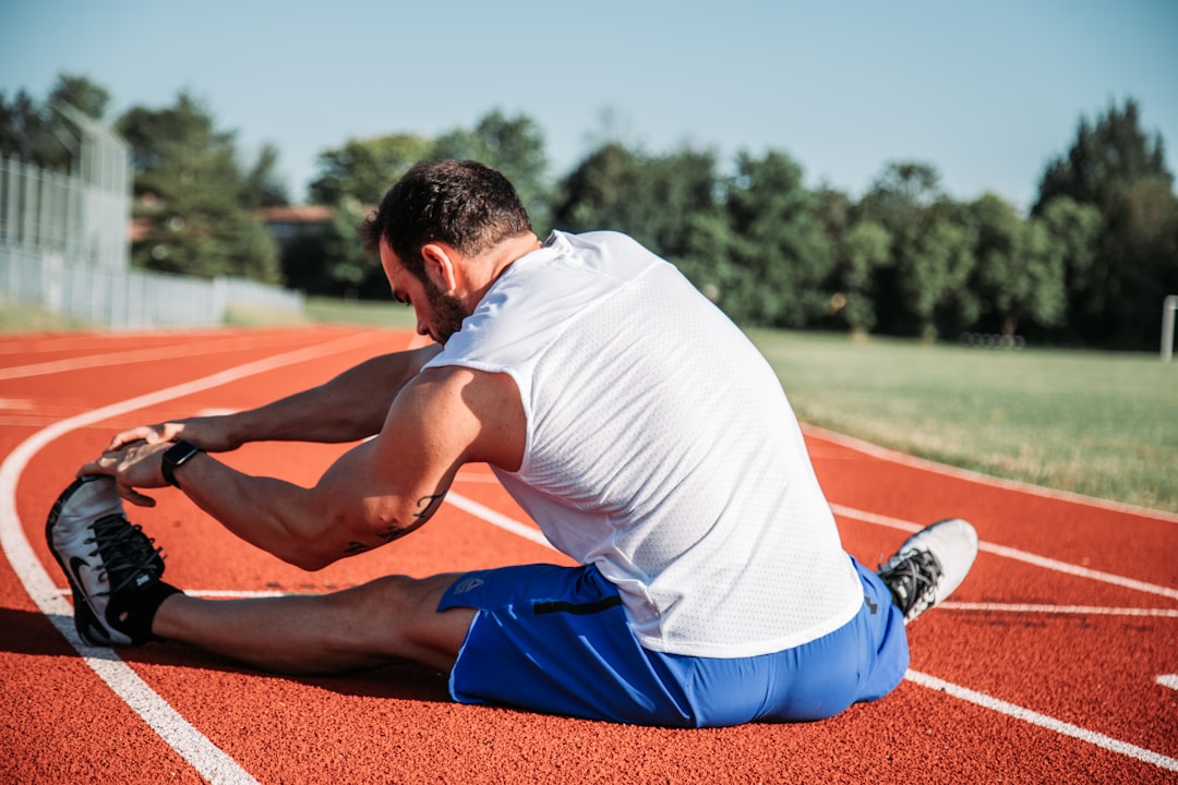Athlete stretching during recovery after a workout