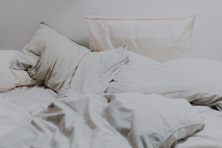 White pillows arranged on a bed