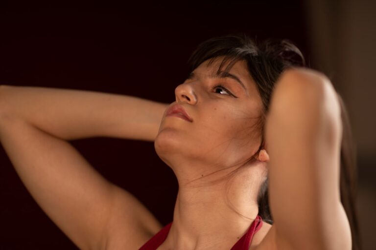Woman gently tilting her head in a neck stretch