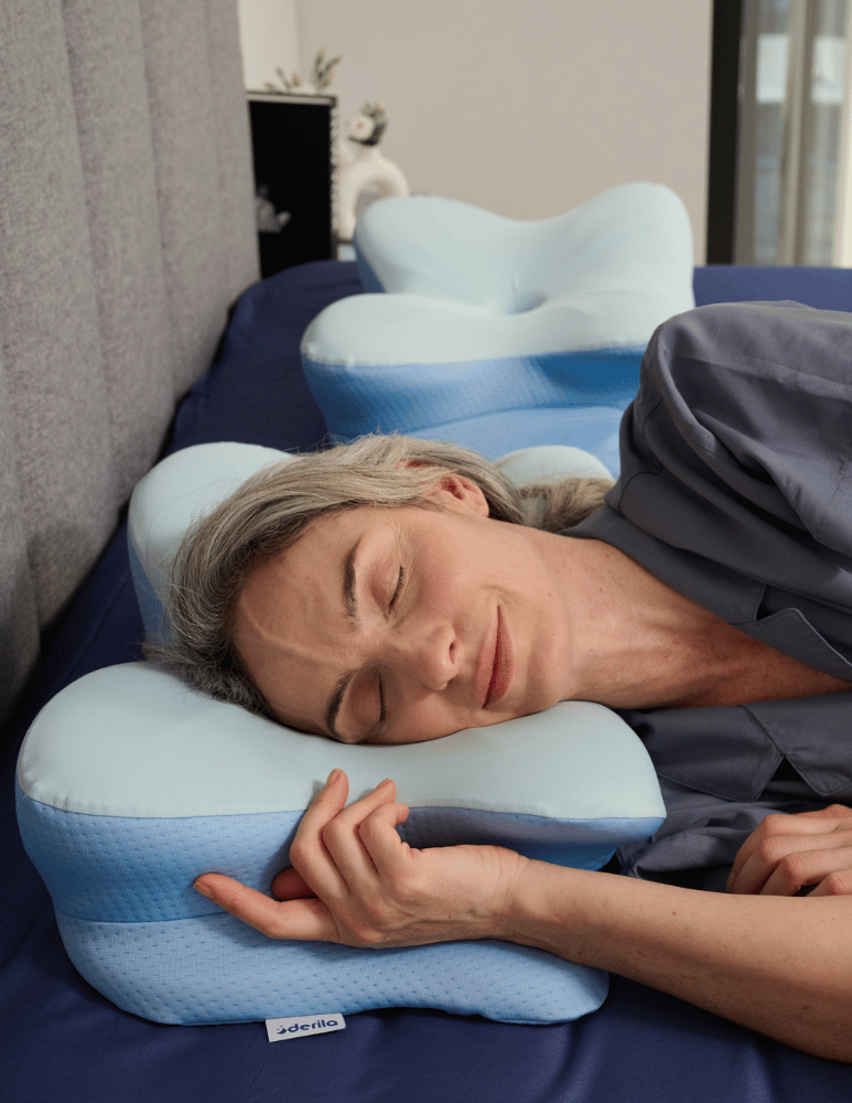Side sleeper resting on the Derila Ergo memory foam pillow with the neck supported